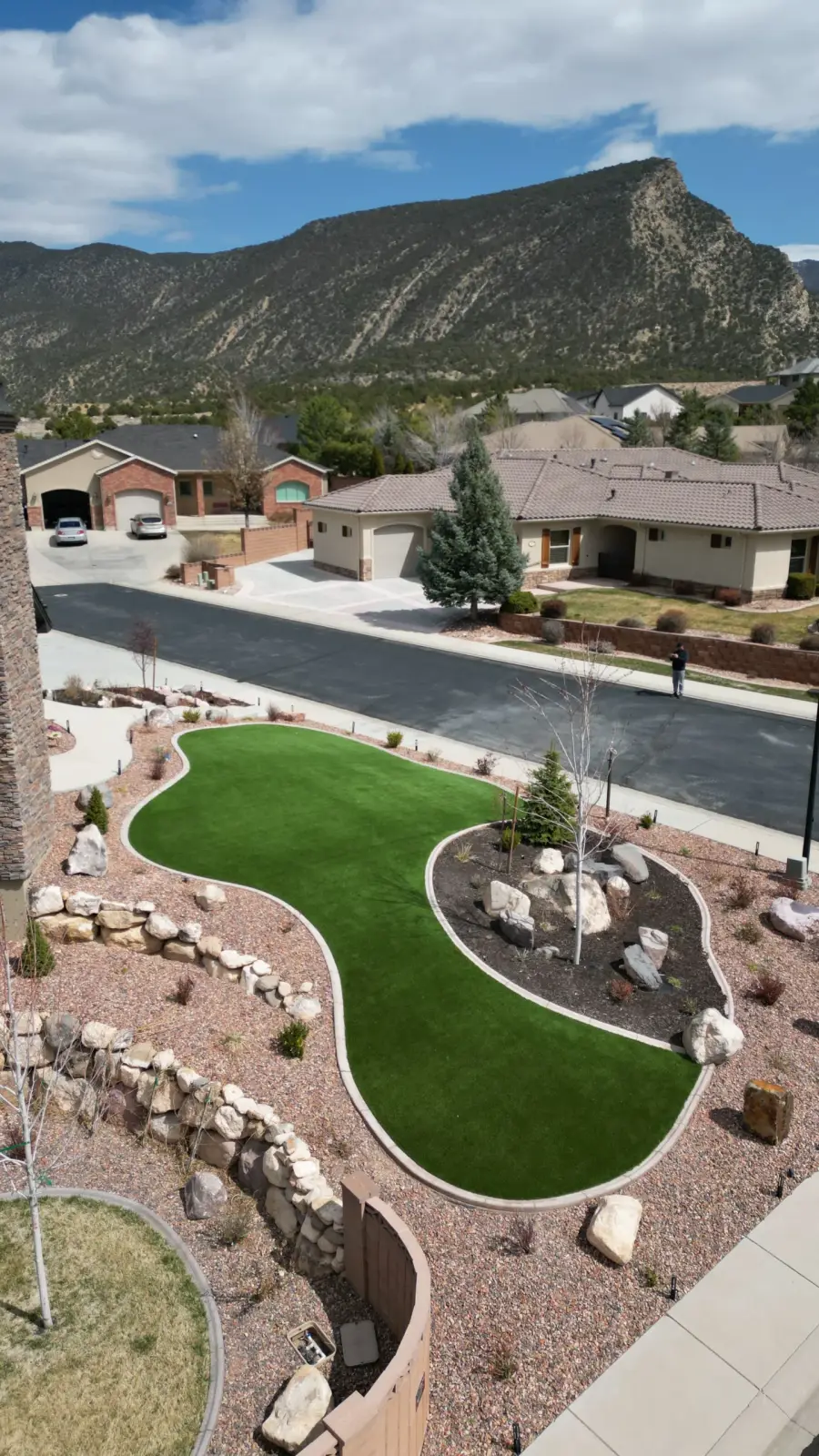 Aerial view of turf framed by rock beds