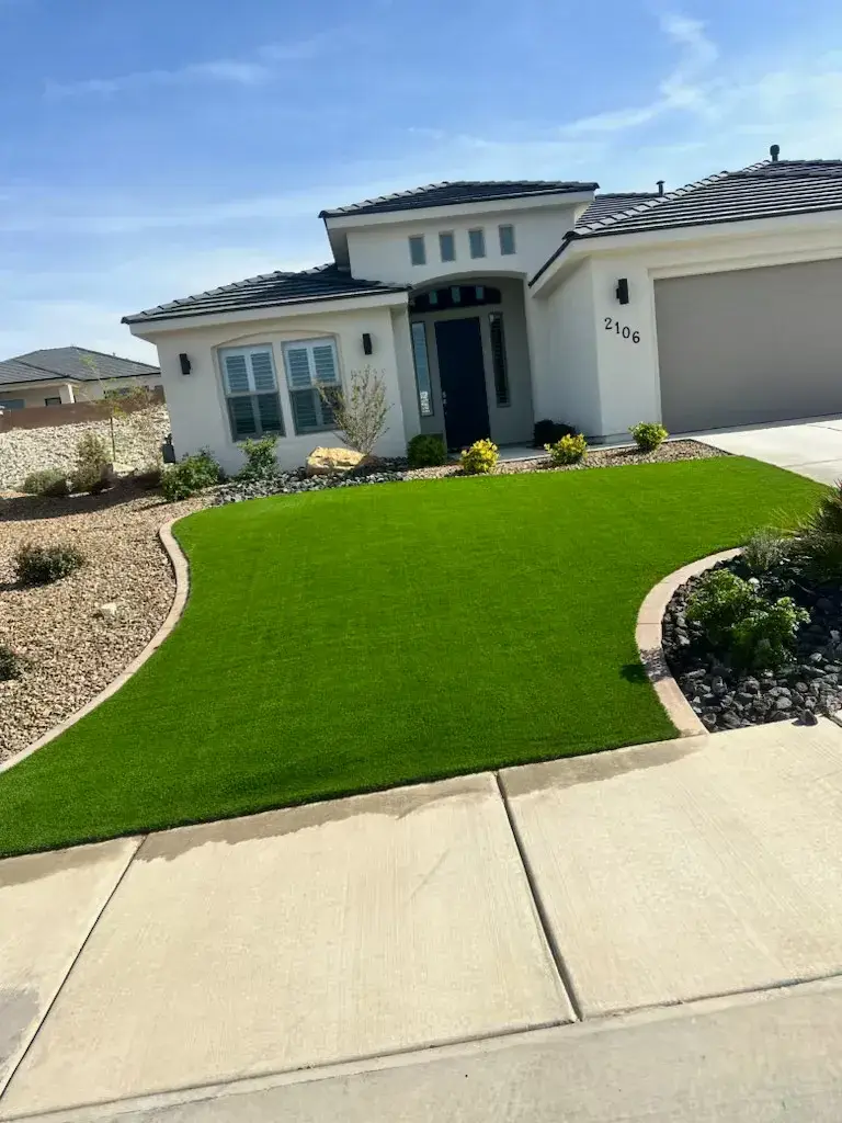 Turf front yard with rock borders