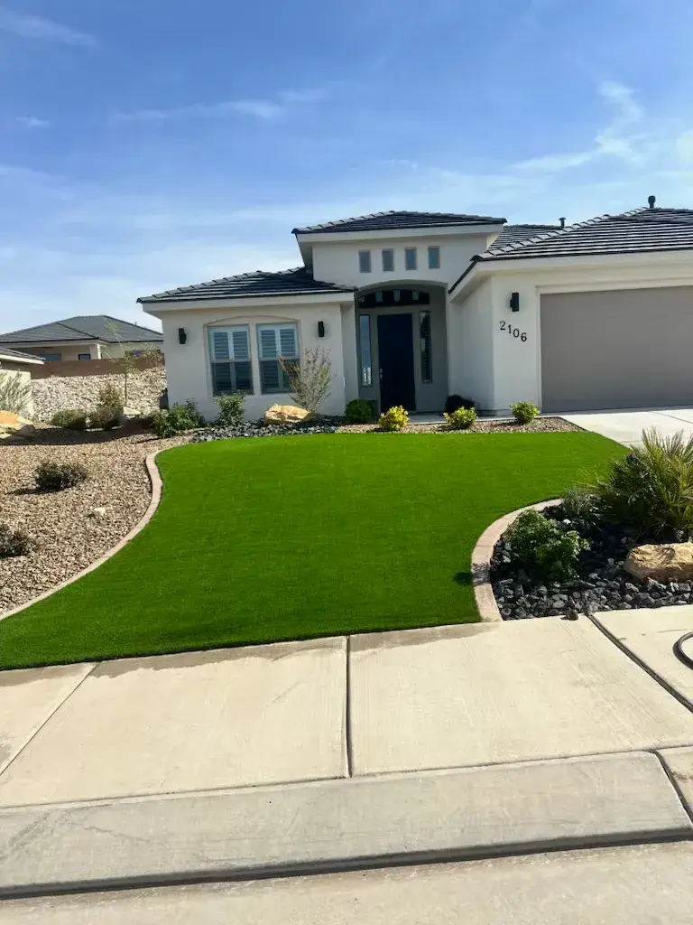 New-construction home with turf front yard