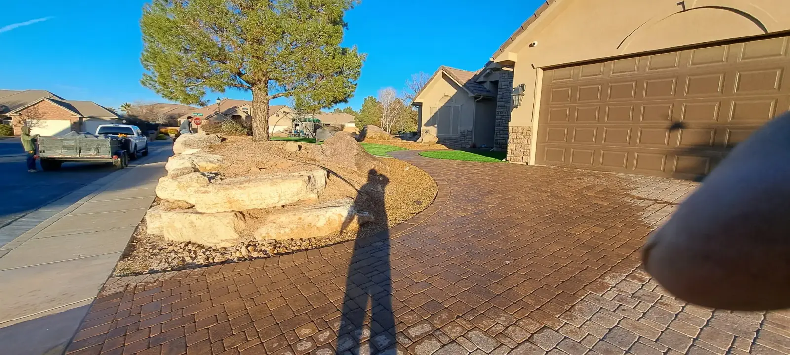 Turf lawn along a paver entry