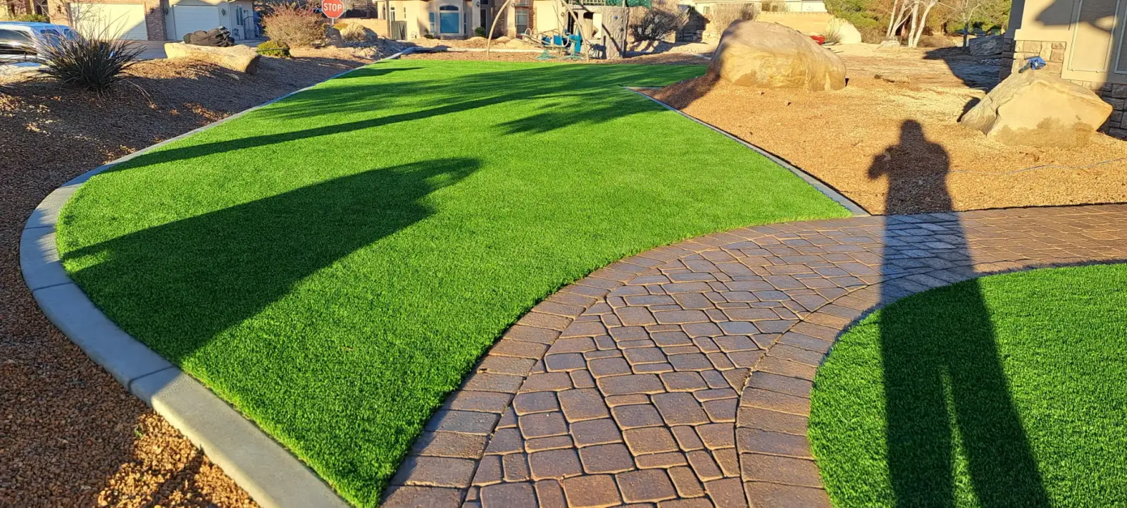 Turf lawn beside a paver path